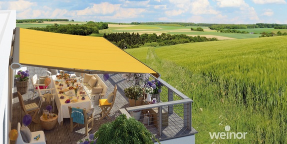 Gelbe weinor Markise über Balkon